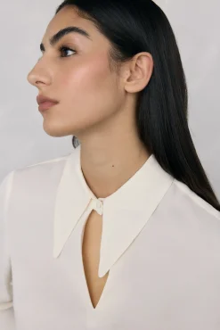 Blusa com punhos de penas