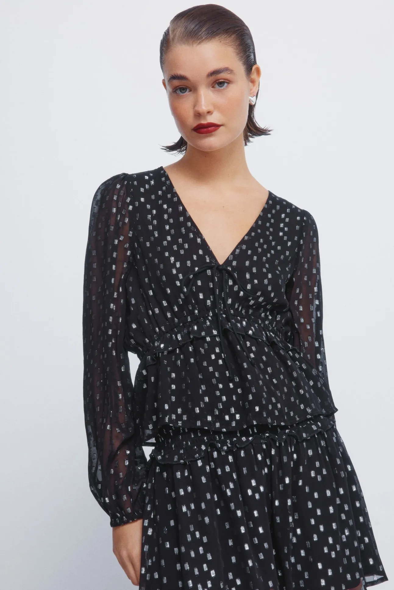Blusa de lurex com cós elástico