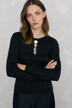 Blusa de malha brilhante com aberturas