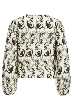 Blusa de tecido bordado