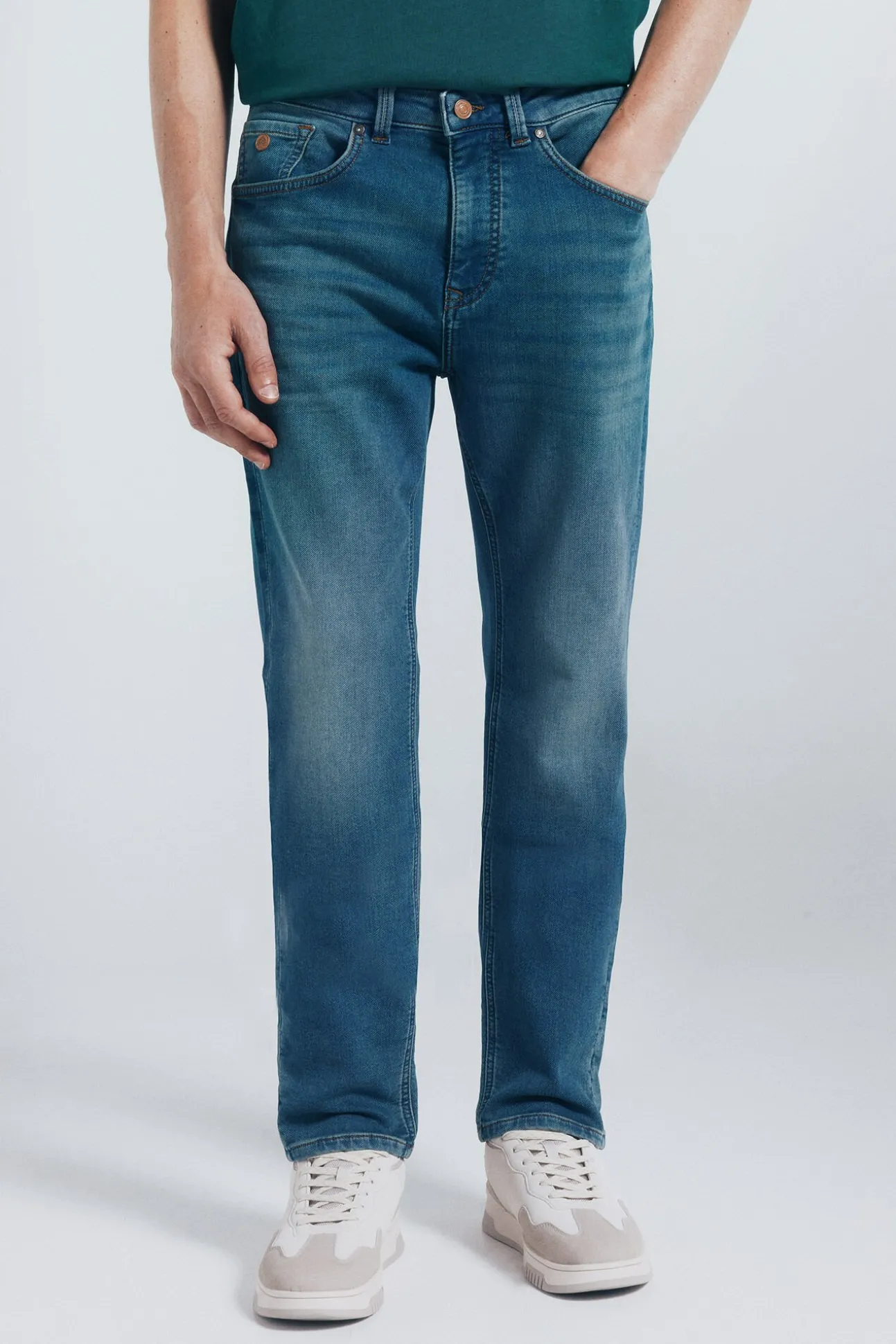 Calça jeans slim fit de malha denim