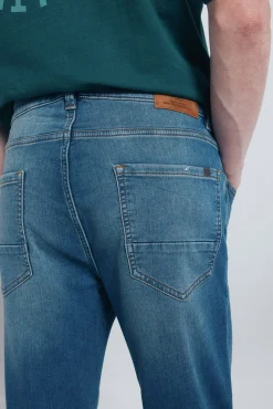 Calça jeans slim fit de malha denim