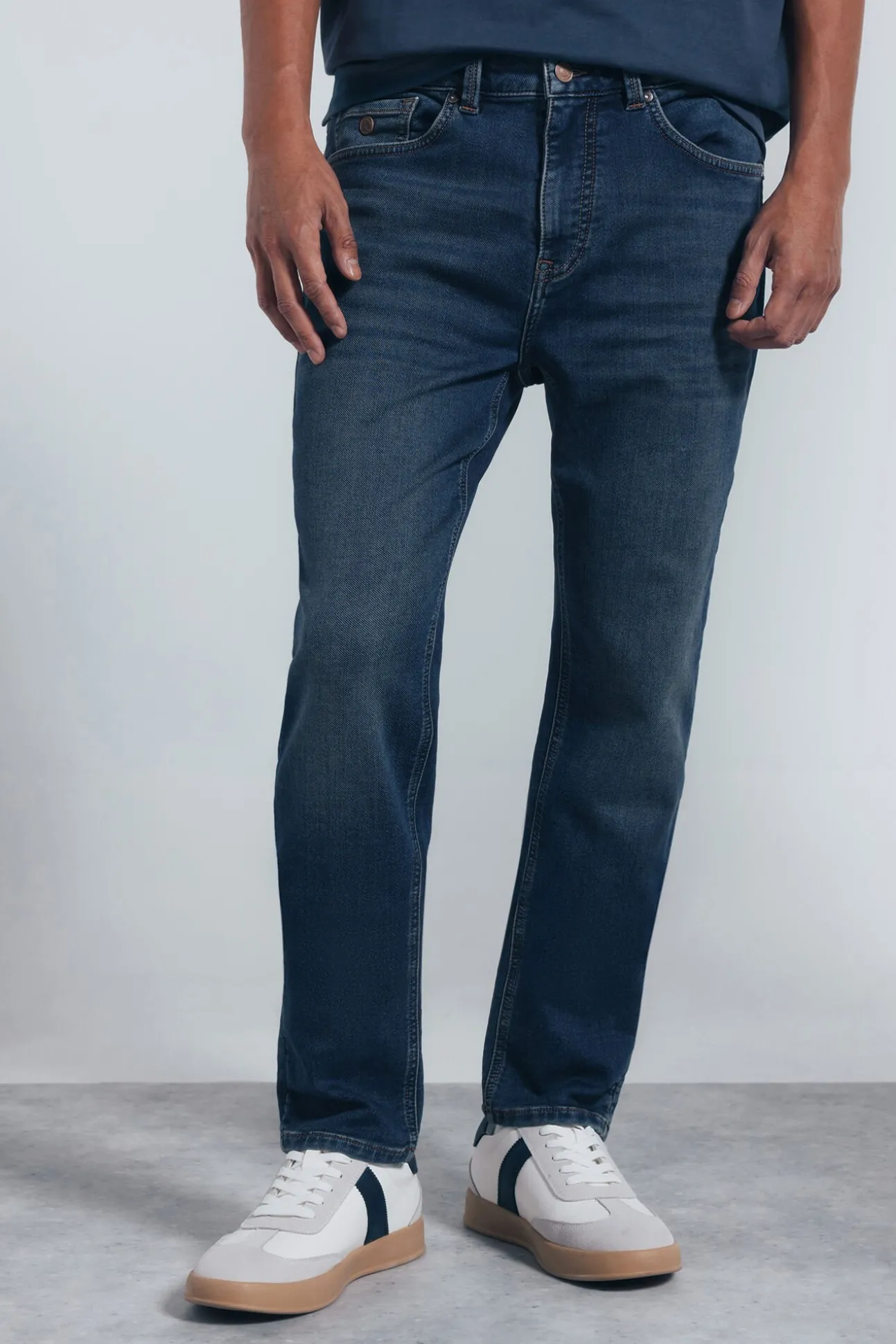 Calça jeans slim fit de malha denim