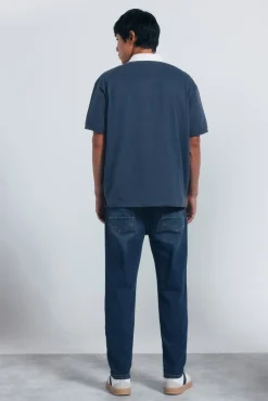 Calça jeans slim fit de malha denim