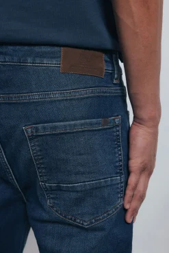 Calça jeans slim fit de malha denim