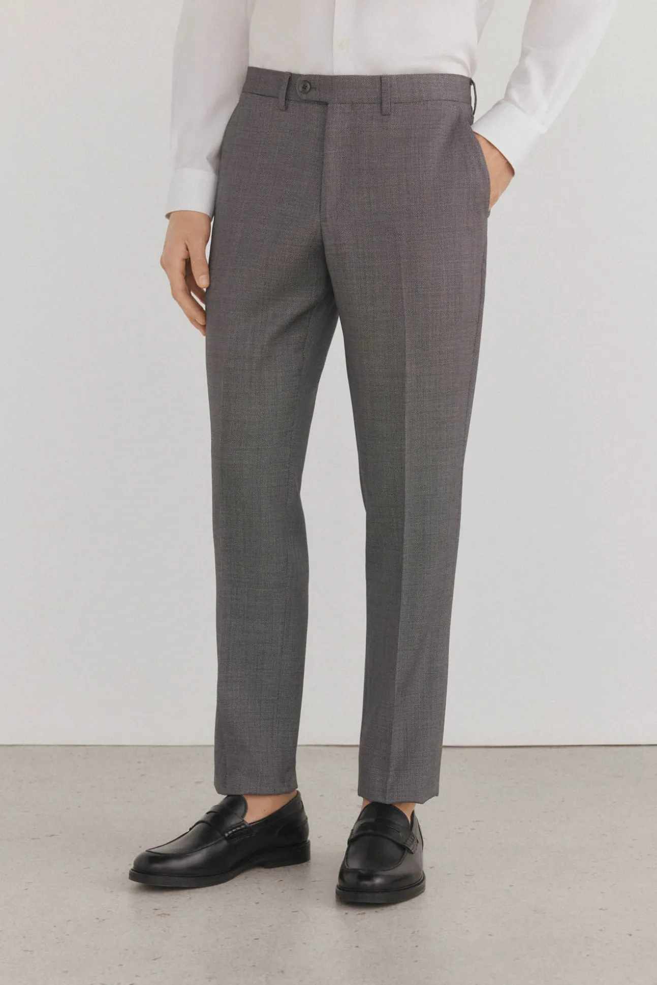 Calças estilo olho de pássaro, com modelagem slim fit e bielástica