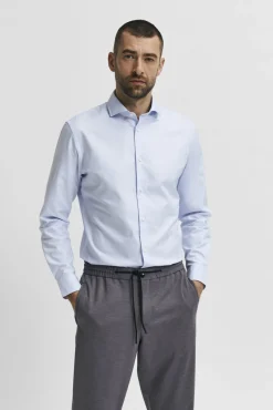 Camisa de manga comprida de vestir 100% algodão.