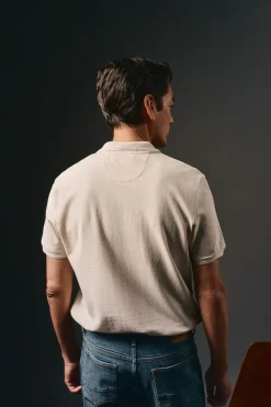 Camisa polo piqué lavada com bordado de avião