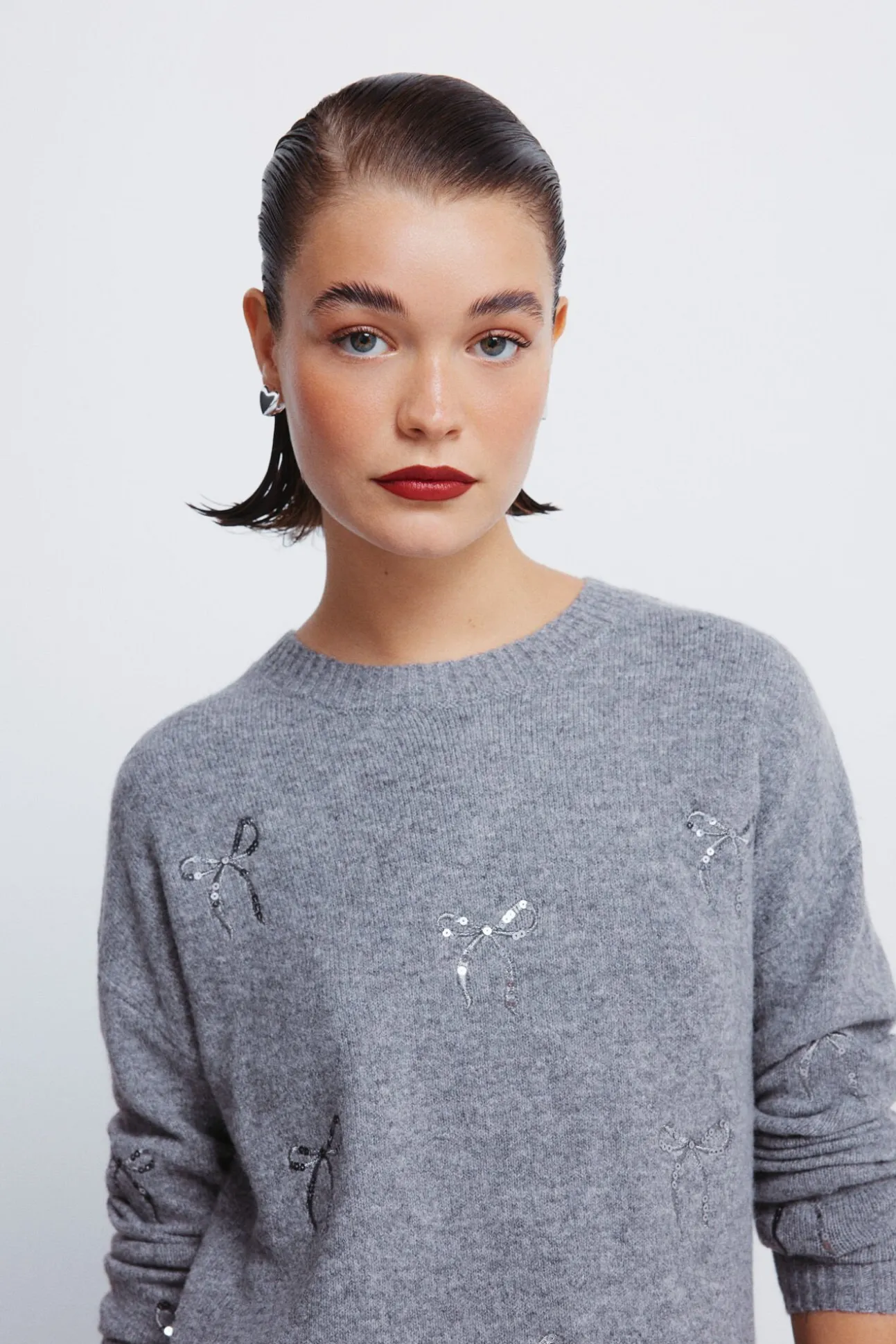 Camisola com laços de lantejoulas