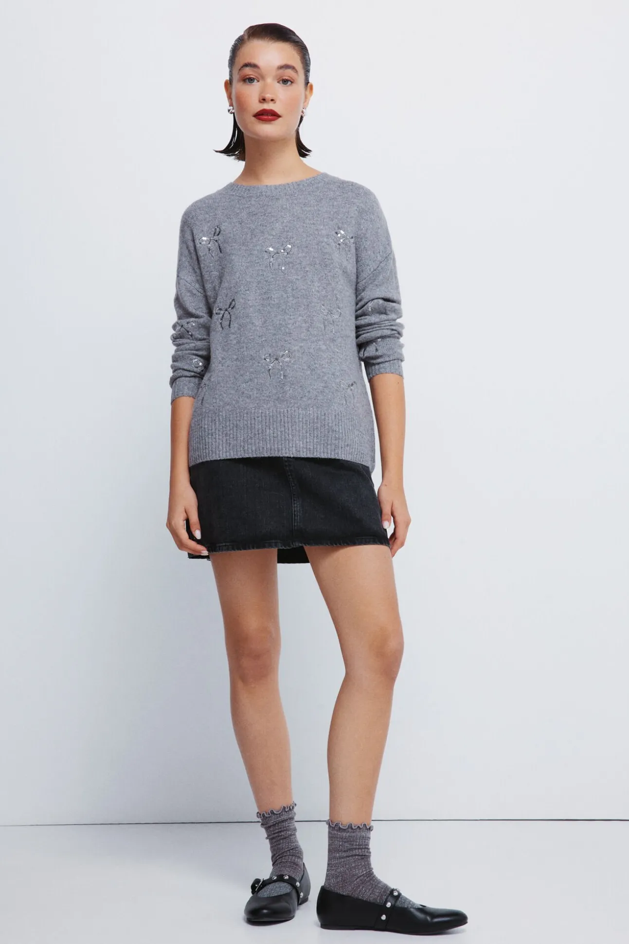 Camisola com laços de lantejoulas