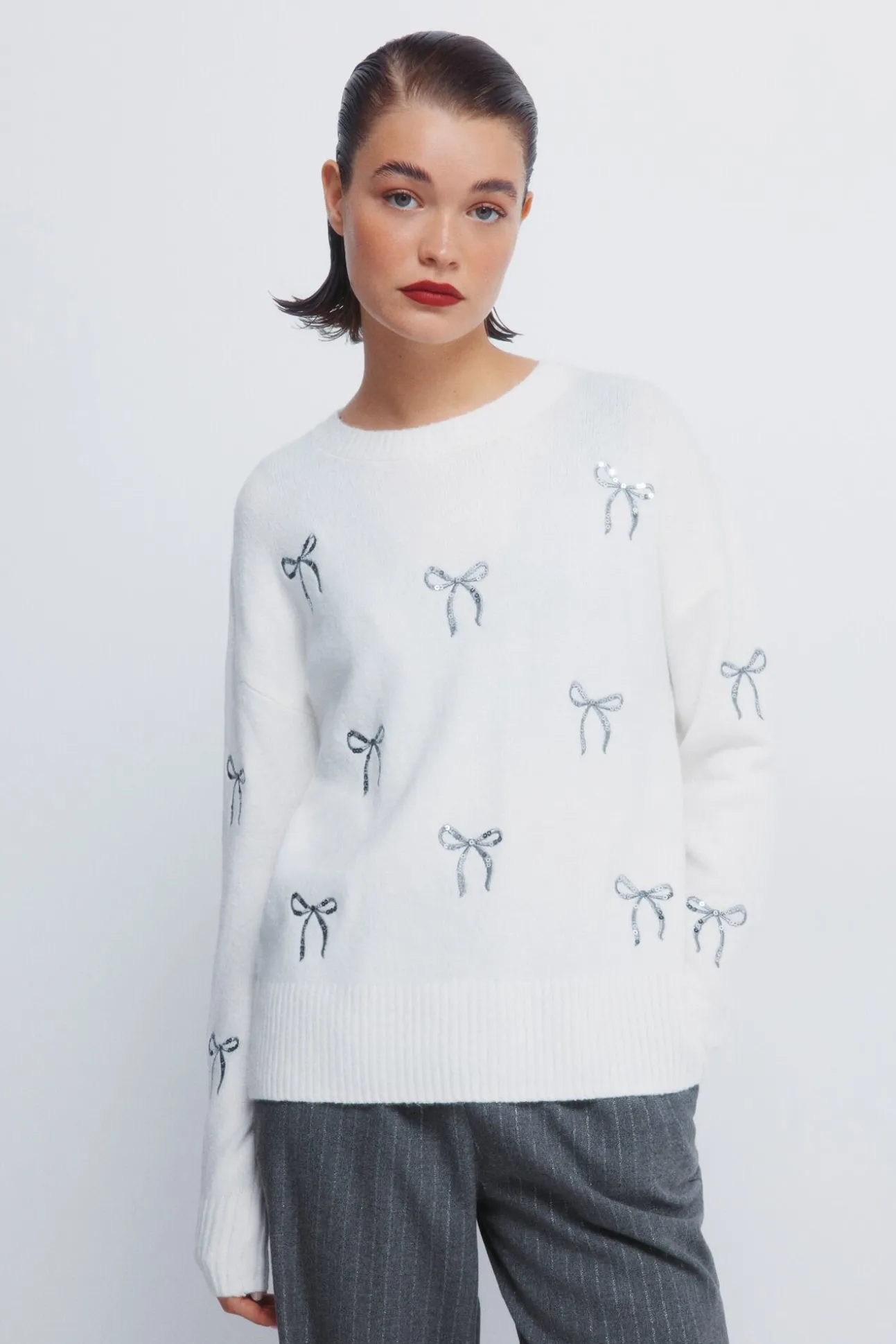 Camisola com laços de lantejoulas