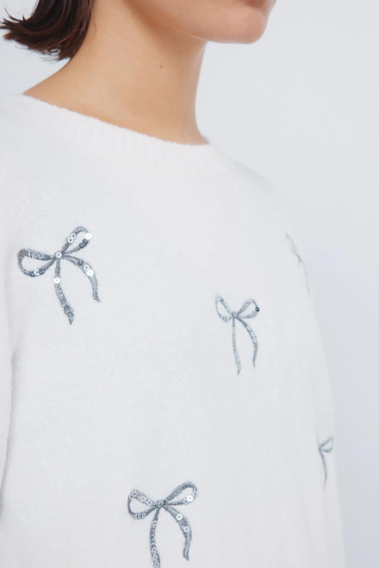 Camisola com laços de lantejoulas