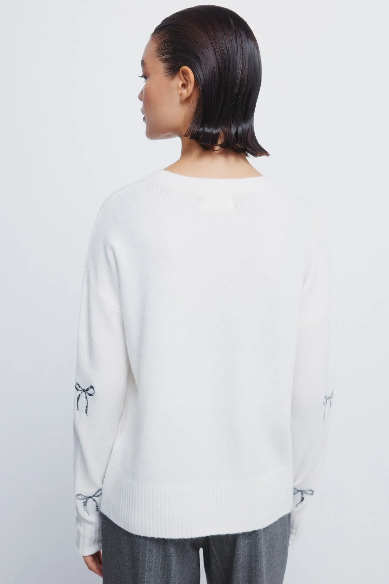 Camisola com laços de lantejoulas