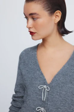 Cardigan com laços brilhantes