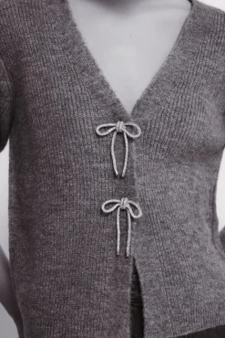 Cardigan com laços brilhantes