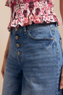 Jeans de botões largos