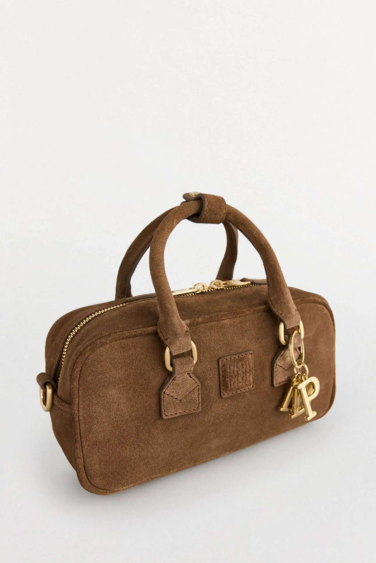 mini bolsa de boliche com mala de tiracolo de pele