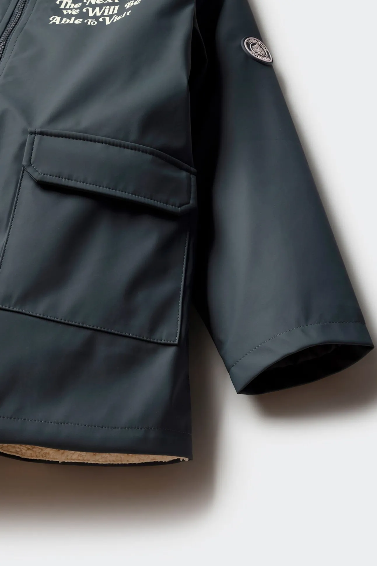 Parka azul marinho com frase para criança