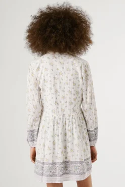 Vestido curto de manga comprida com estampado floral.